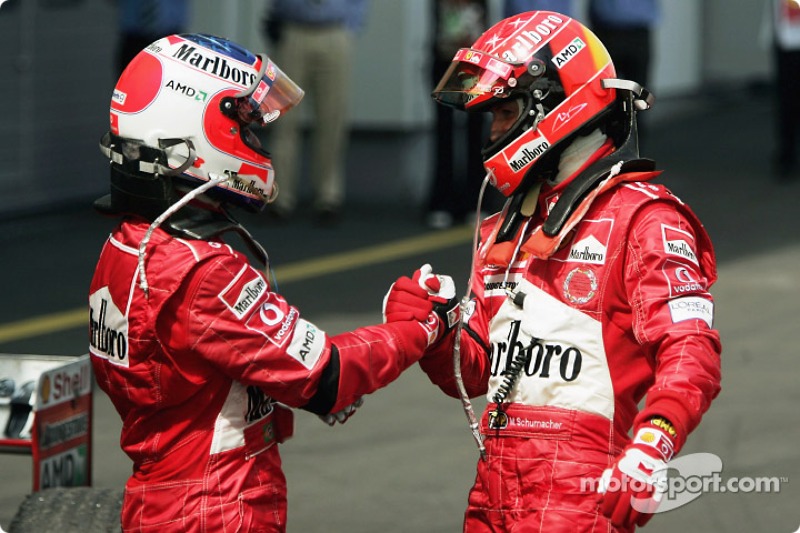 Race winner Michael Schumacher celebrates with Rubens Barrichello