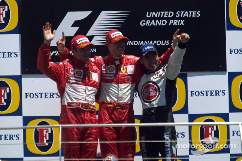 Podium: race winner Michael Schumacher with Rubens Barrichello and Takuma Sato