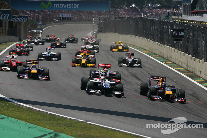 Sebastian Vettel, Red Bull Racing passes Nico Hulkenberg, Williams F1 Team at the start of the race