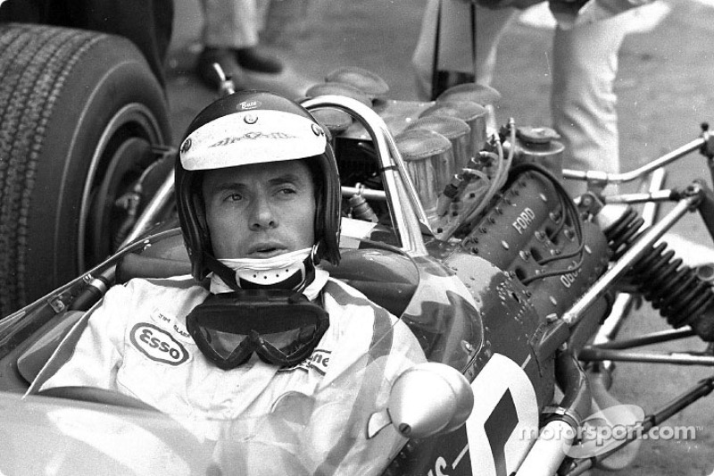 Jim Clark in the cockpit of his Lotus 49 with the Ford DFV V8 engine behind him; Clark won the 1967 Grand Prix of Holland at Zandvoort with this engine in its debut race