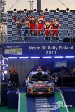 Podium: winners Sébastien Loeb and Daniel Elena, second place Jari-Matti Latvala and Miikka Anttila, third place Sébastien Ogier and Julien Ingrassia