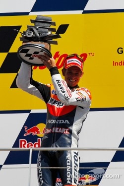 Podium: race winner Casey Stoner, Repsol Honda Team, celebrates his seventh victory of the 2011 season
