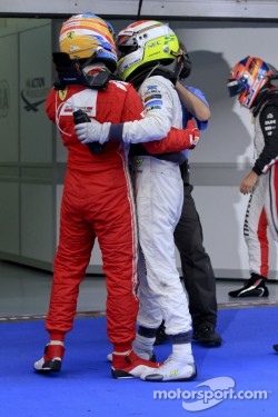 Race winner Fernando Alonso, Scuderia Ferrari and second place Sergio Perez, Sauber F1 Team