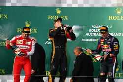 The podium, Ferrari, second; Jenson Button, McLaren, race winner; Fernando Alonso, Ferrari, third