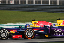 Sebastian Vettel, Red Bull Racing RB9 and team mate Mark Webber, Red Bull Racing RB9 battle for the lead of the race