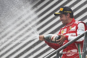 Race winner Fernando Alonso, Ferrari celebrates on the podium