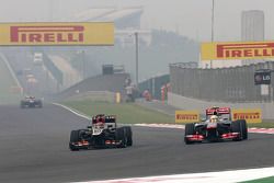 Kimi Raikkonen, Lotus F1 Team and Sergio Perez, McLaren Mercedes