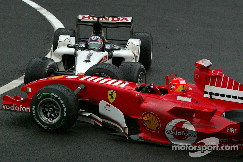 Michael Schumacher and Takuma Sato crash