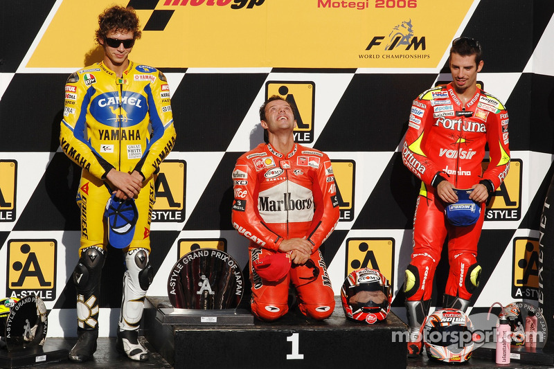 Podium: race winner Loris Capirossi with Valentino Rossi and Marco Melandri