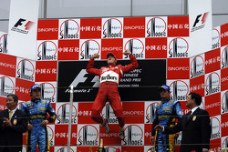 Podium: race winner Michael Schumacher with Fernando Alonso and Giancarlo Fisichella