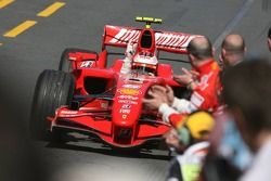 Race winner Kimi Raikkonen celebrates