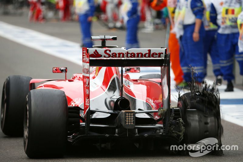 Sebastian Vettel, Ferrari with his punctured Pirelli tyre