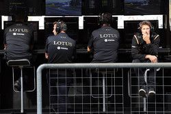 Paul Seaby, Lotus F1 Team Team Manager, Matthew Carter, Lotus F1 Team CEO, Federico Gastaldi, Lotus F1 Team Deputy Team Principal, and Romain Grosjean, Lotus F1 Team on the pit gantry