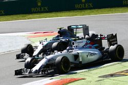 Valtteri Bottas, Williams FW37 and Nico Rosberg, Mercedes AMG F1 W06 battle for position