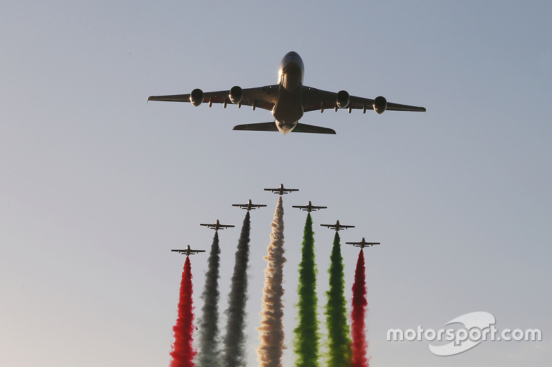 An Etihad plane flies over the grid