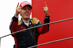 Podium: race winner Sebastian Vettel celebrates