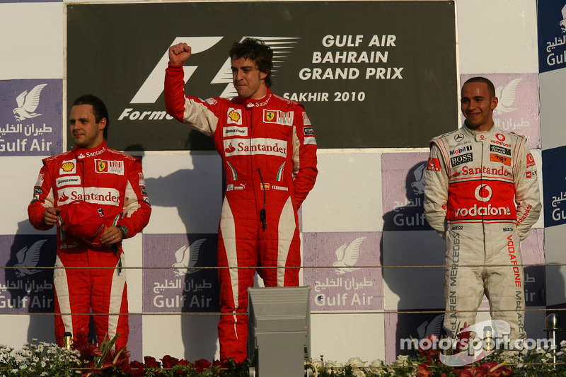 Podium: race winnaar Fernando Alonso, Scuderia Ferrari, 2de Felipe Massa, Scuderia Ferrari, en 3de L